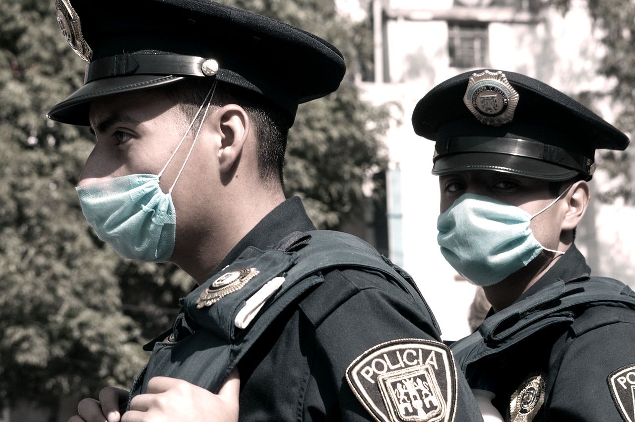 Mexican police officers with masks on swine flu
