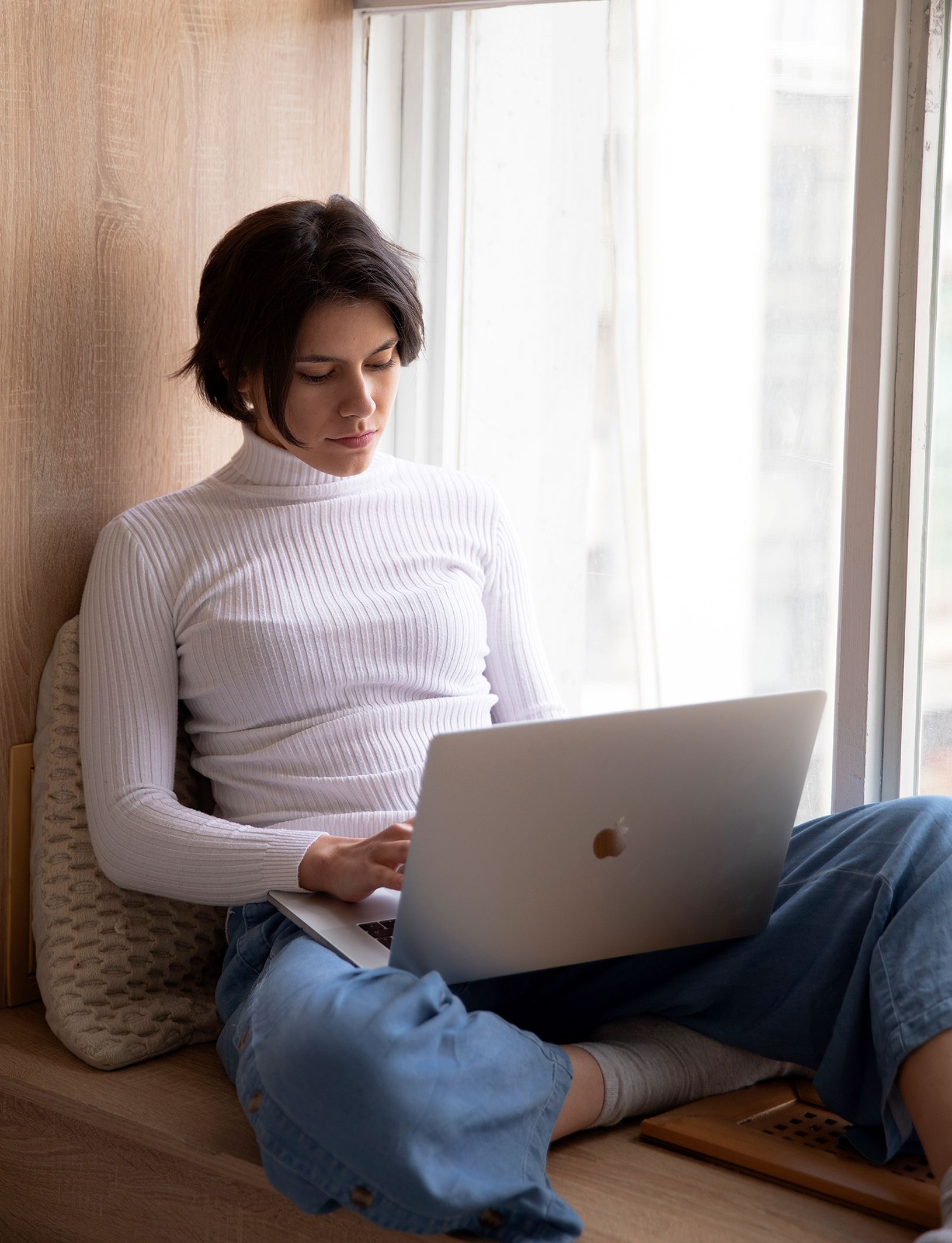 Woman using laptop in loungewear