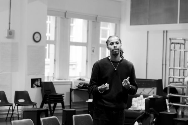 Nicholai is directing the romeo and juliet rehearsals in a black and white image.