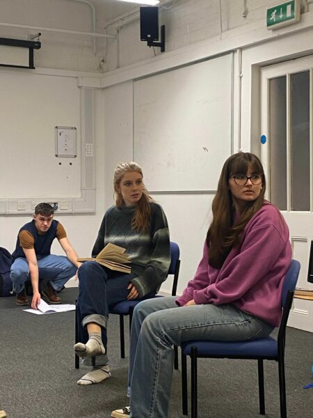 Kitty Sharland and Natalie Leaper in rehearshals on chairs