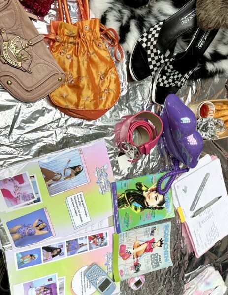 A selection of early 2000s memorabilia and accessories laid out on a table