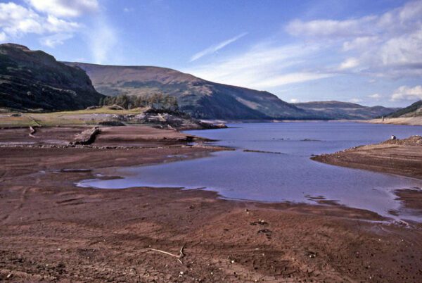 Haweswater Reservoir at a low water level, mud flats are visible
