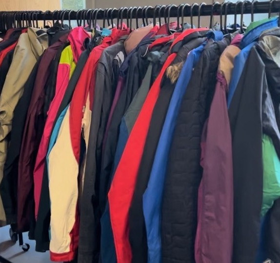 A selection of jackets on a clothing rail 