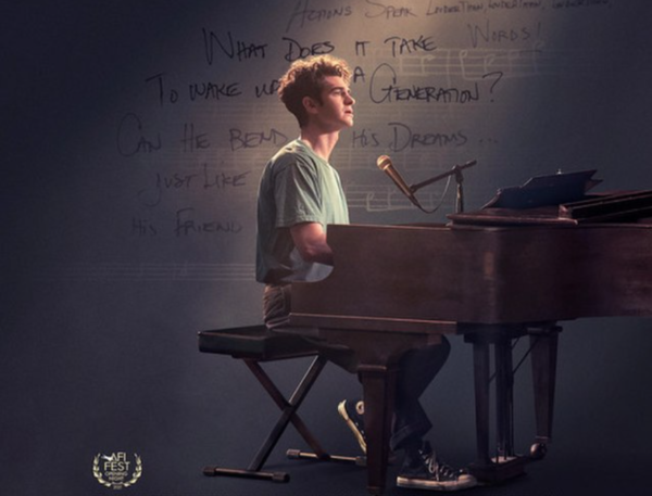 Andrew Garfield as Jonathan Larson playing the piano
