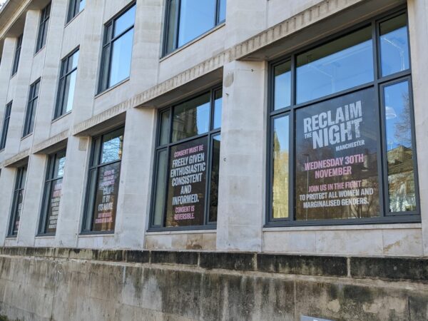 Outside of the Studentrs Union building showing reclaim the night posters on the windows