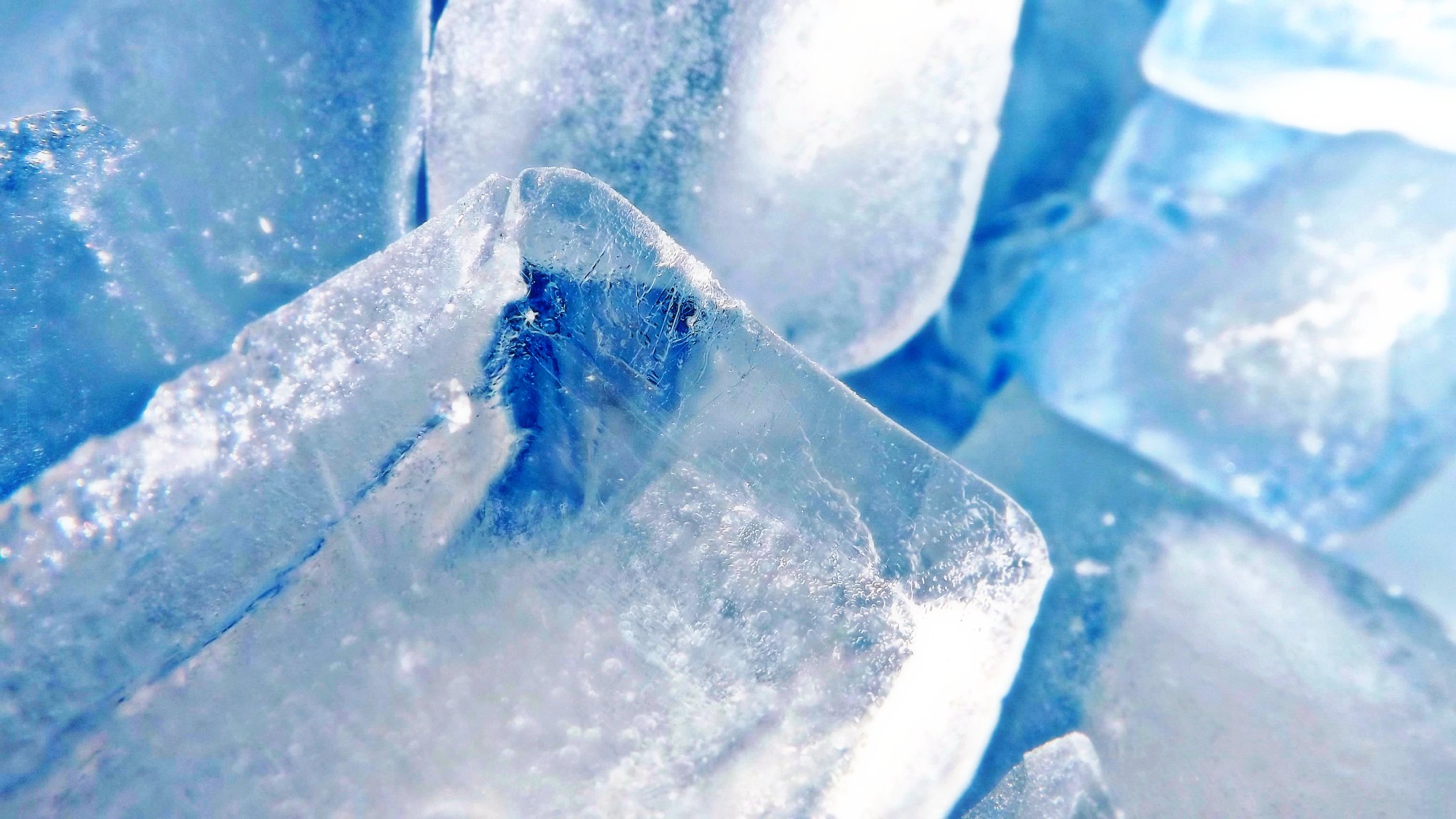 Ice cubes with a blue background